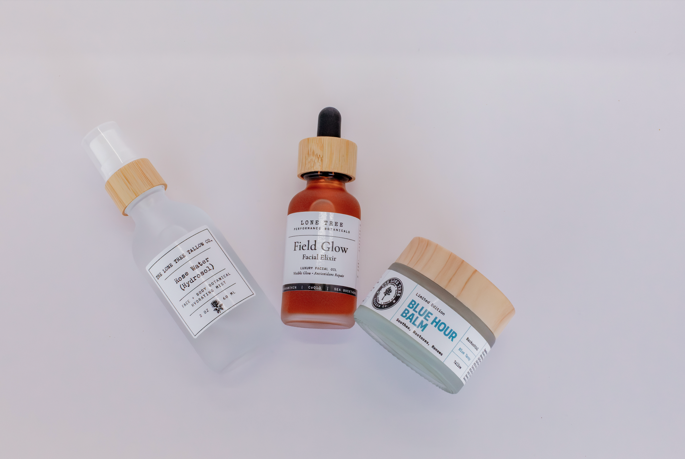 blue hour ritual skincare set for hormonal, perimenopausal or menopausal skin. includes rose water hydrosol, field glow luxury facial oil with astaxanthin and blue hour tallow face balm with bakuchiol and blue tansy. 