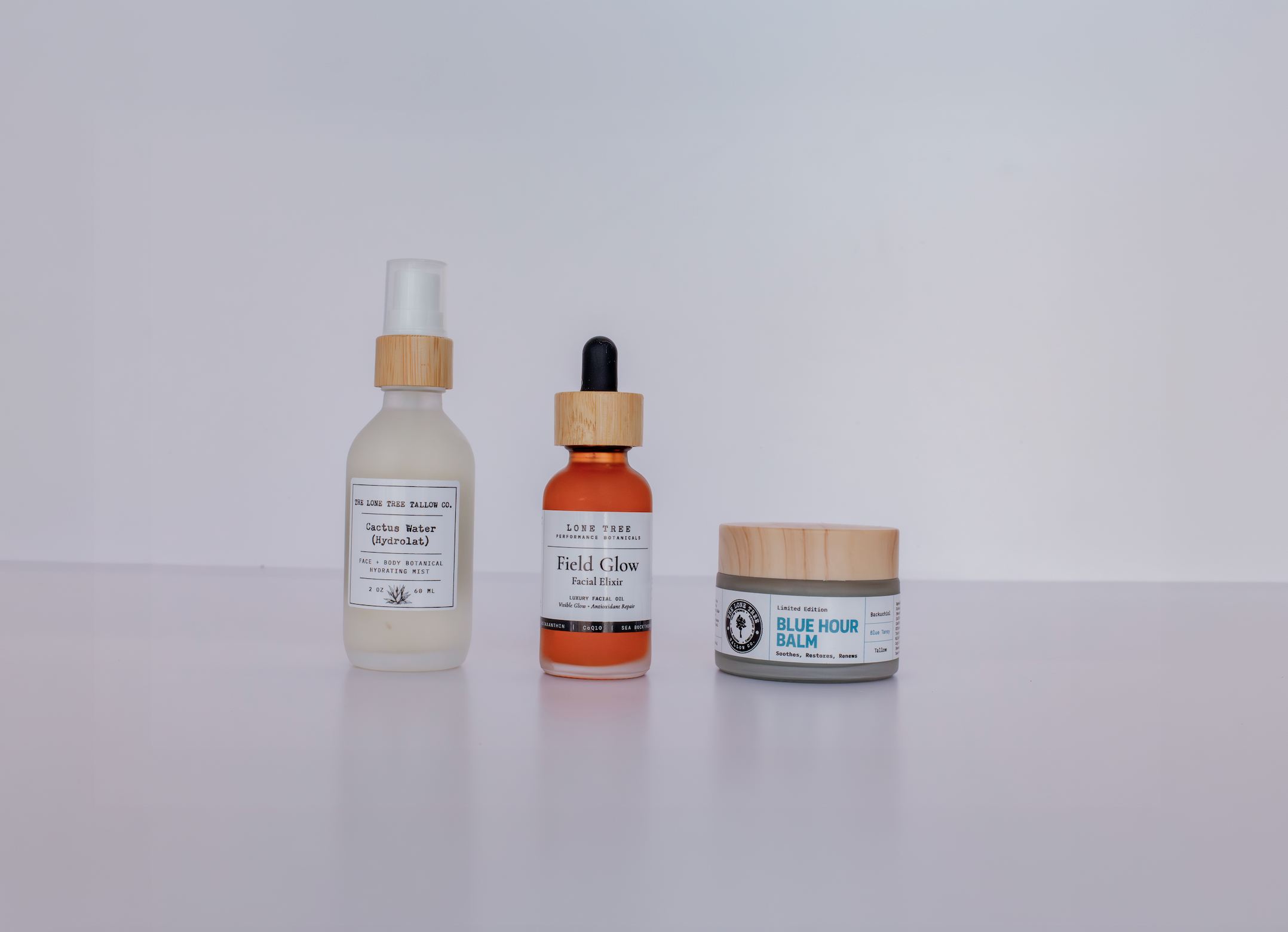 blue hour ritual skincare set for hormonal, perimenopausal or menopausal skin. includes cactus water hydrolat, field glow luxury facial oil with astaxanthin and blue hour tallow face balm with bakuchiol and blue tansy. 