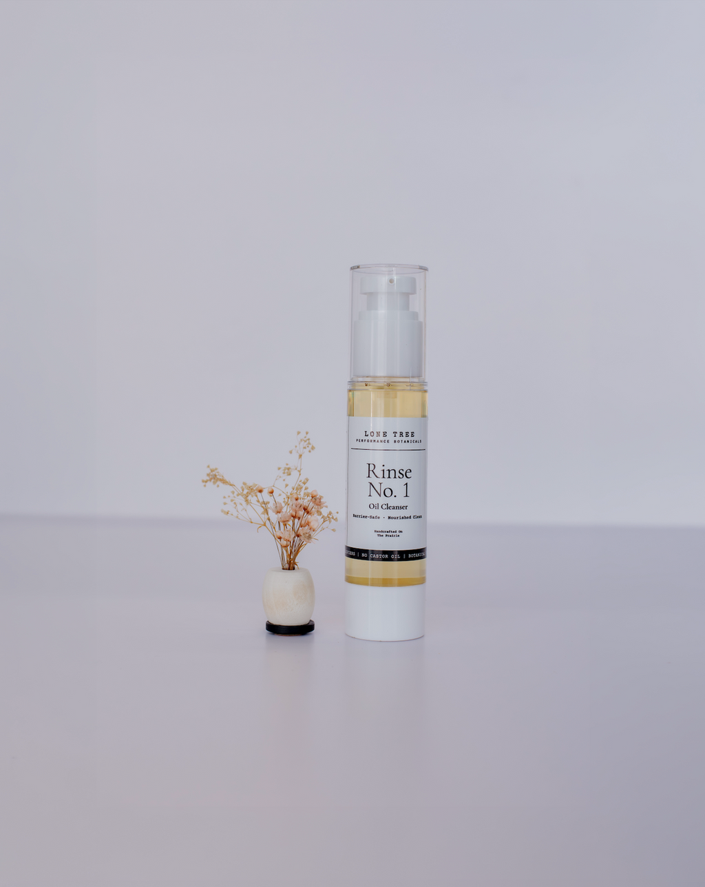 Rinse No. 1 Oil Cleanser does not strip your skin's natural barrier and is great for perimenopausal, menopausal, or hormonal skin.  This picture shows a 2oz container. No castor oil, emulsifers, or fragrances. Just luxury oils that melt away makeup and dirt, leaving skin feeling soft and clean. 